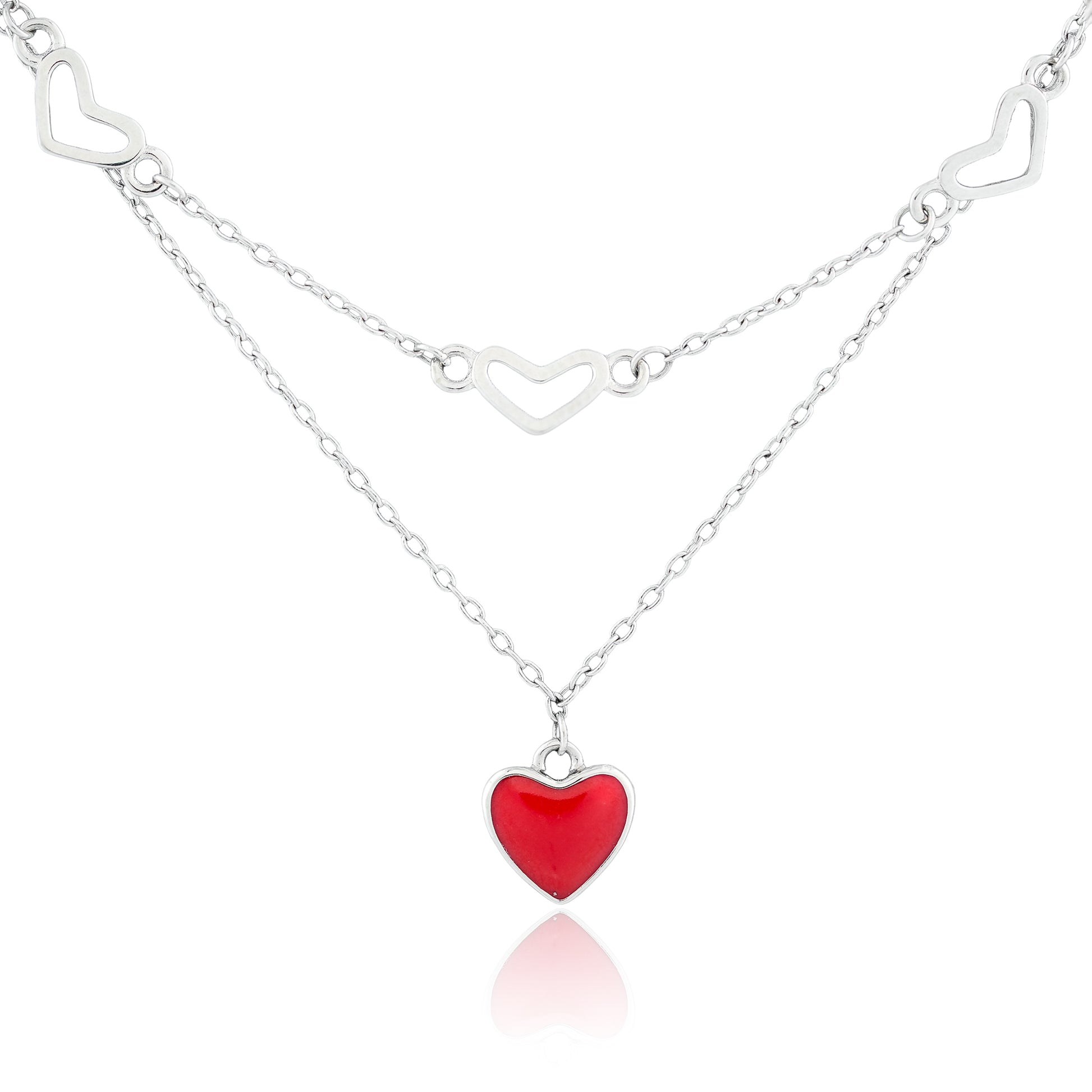 Close-up of the Hearts in Harmony Necklace featuring a double-layered sterling silver chain with open-heart motifs and a red enamel heart pendant.