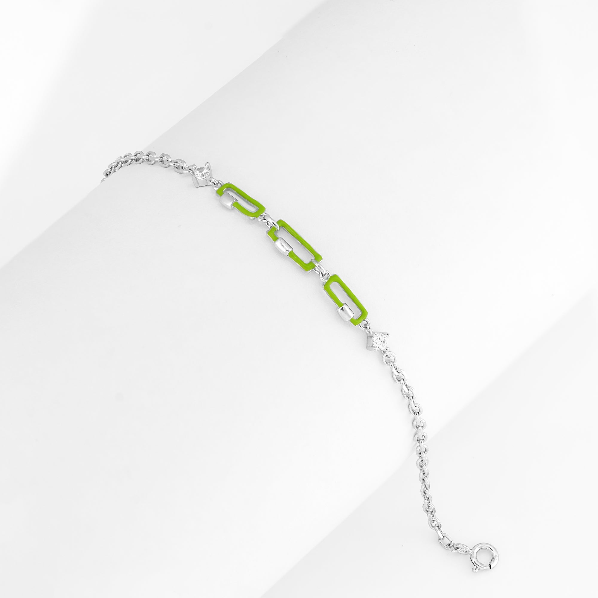 A chunky silver bracelet with neon lime enamel links displayed on a clean background.