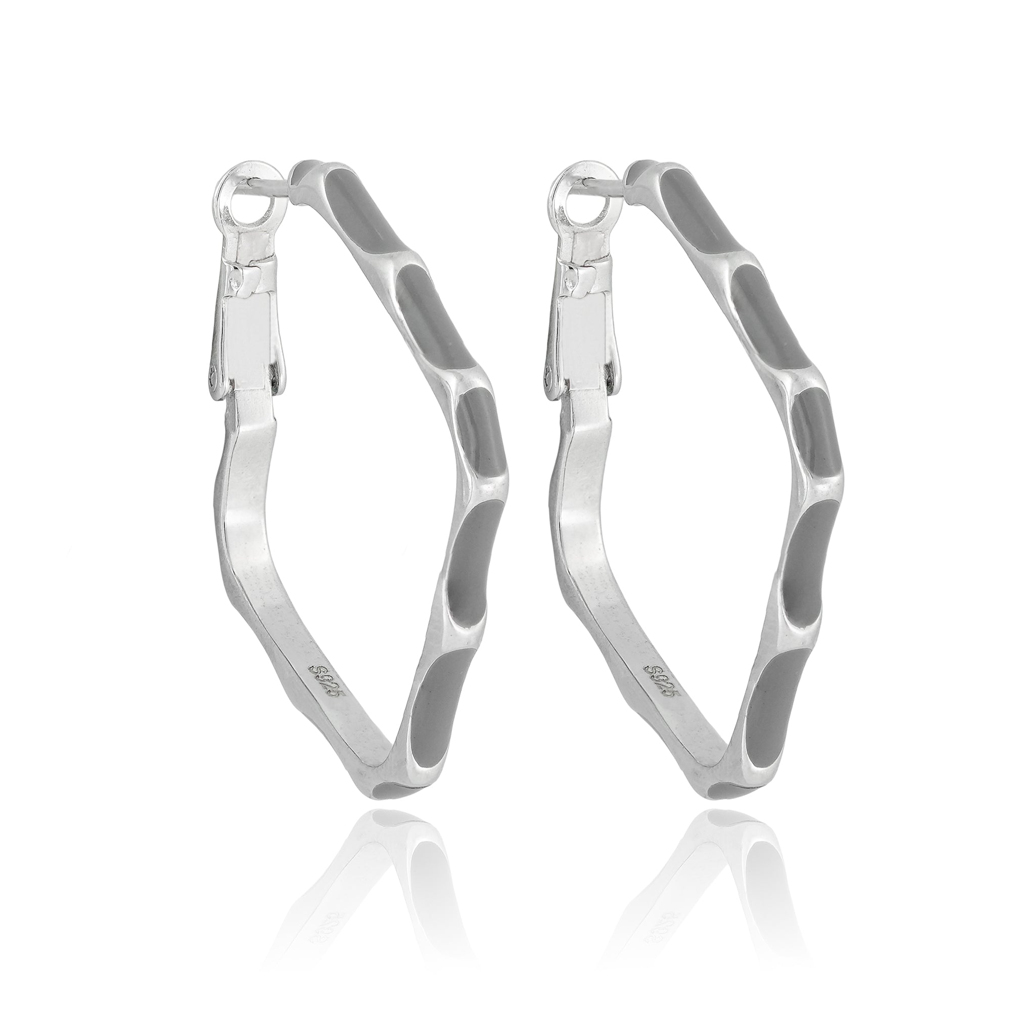 Abstract square silver hoop earrings with wavy edges displayed on a neutral background.