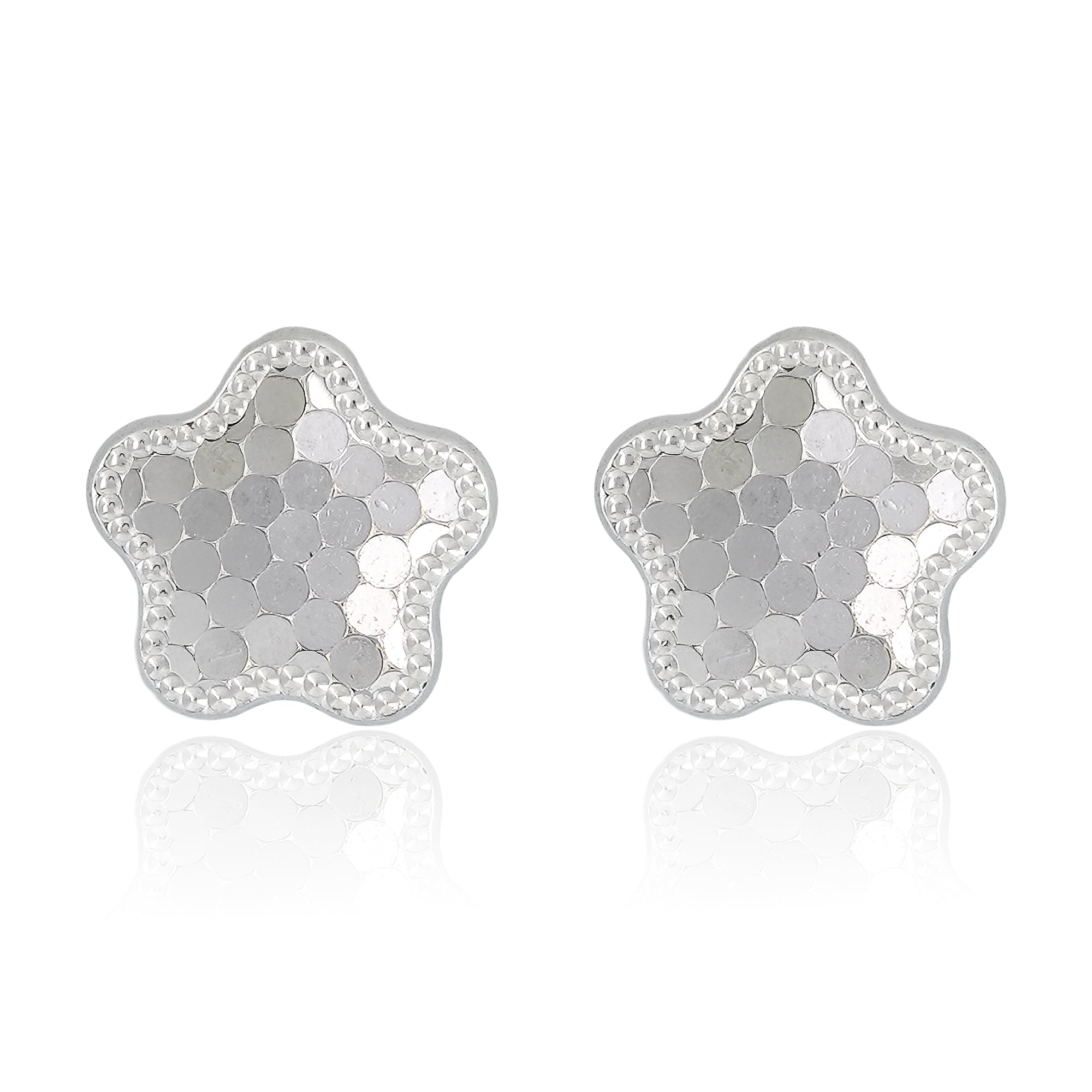 Close-up of Stardust Bloom Stud Earrings featuring star-flower shaped studs with hexagonal textured facets and a beaded border in polished sterling silver.
