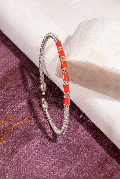 red and silver open bracelet