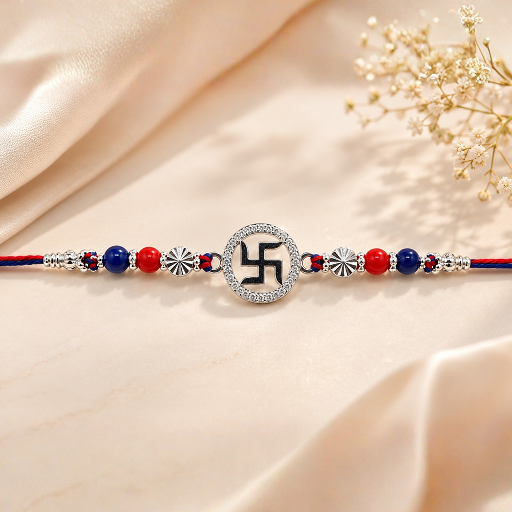 925 Silver Swastik Rakhi – Red & Blue Beads