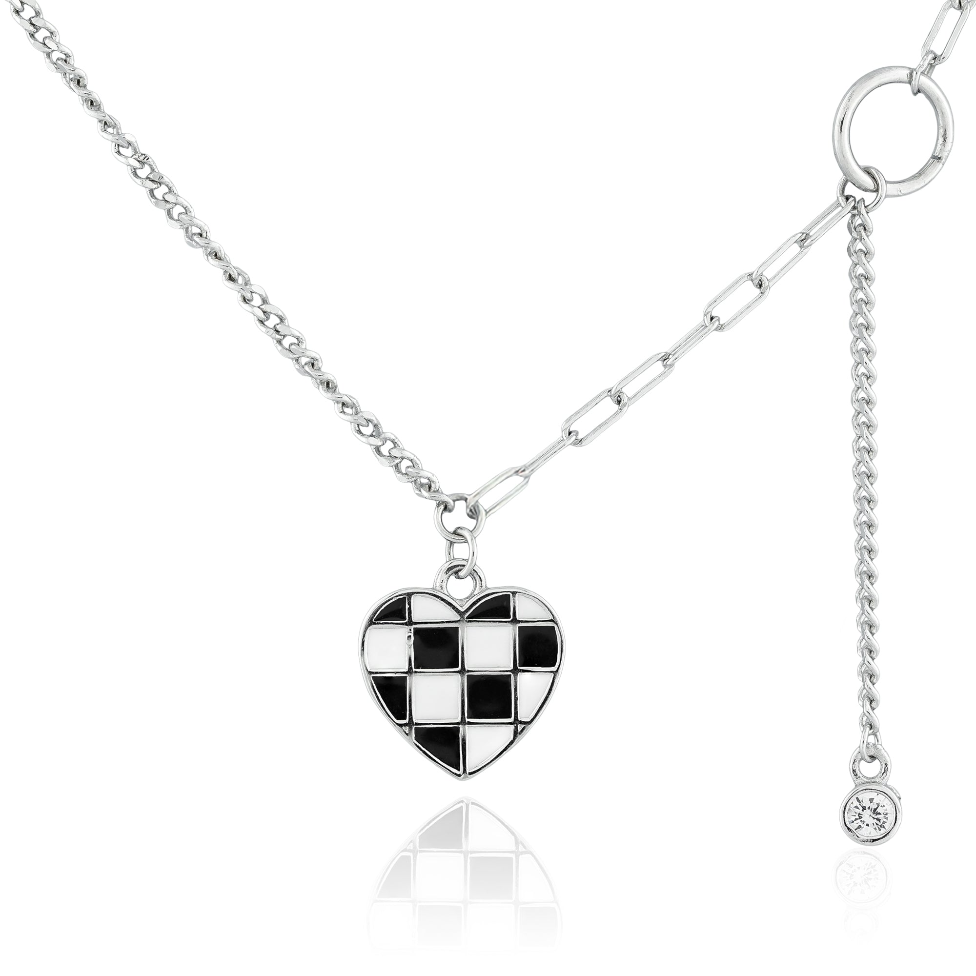 Close-up of the Checkmate Heart Y-Link Necklace featuring a checkerboard heart pendant with enamel detailing and a crystal drop on a Y-link chain.