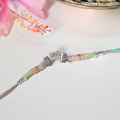 925 silver rakhi featuring dumbbell and Bro charm on dark sporty thread, displayed on plain background.