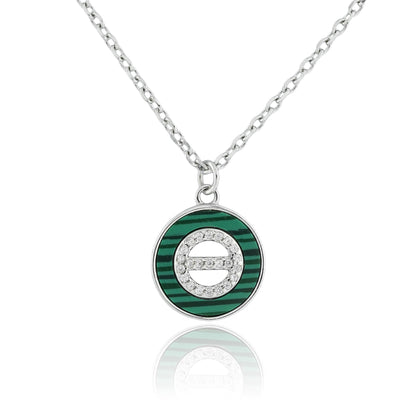 Close-up of the Malachite Orbit Pendant Necklace featuring a circular green malachite inlay with a central cubic zirconia on a sterling silver chain.