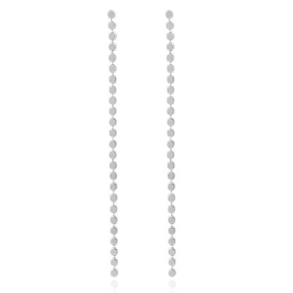 Close-up of Silver Cascade Earrings featuring a vertical line of polished circular discs with a high-shine finish