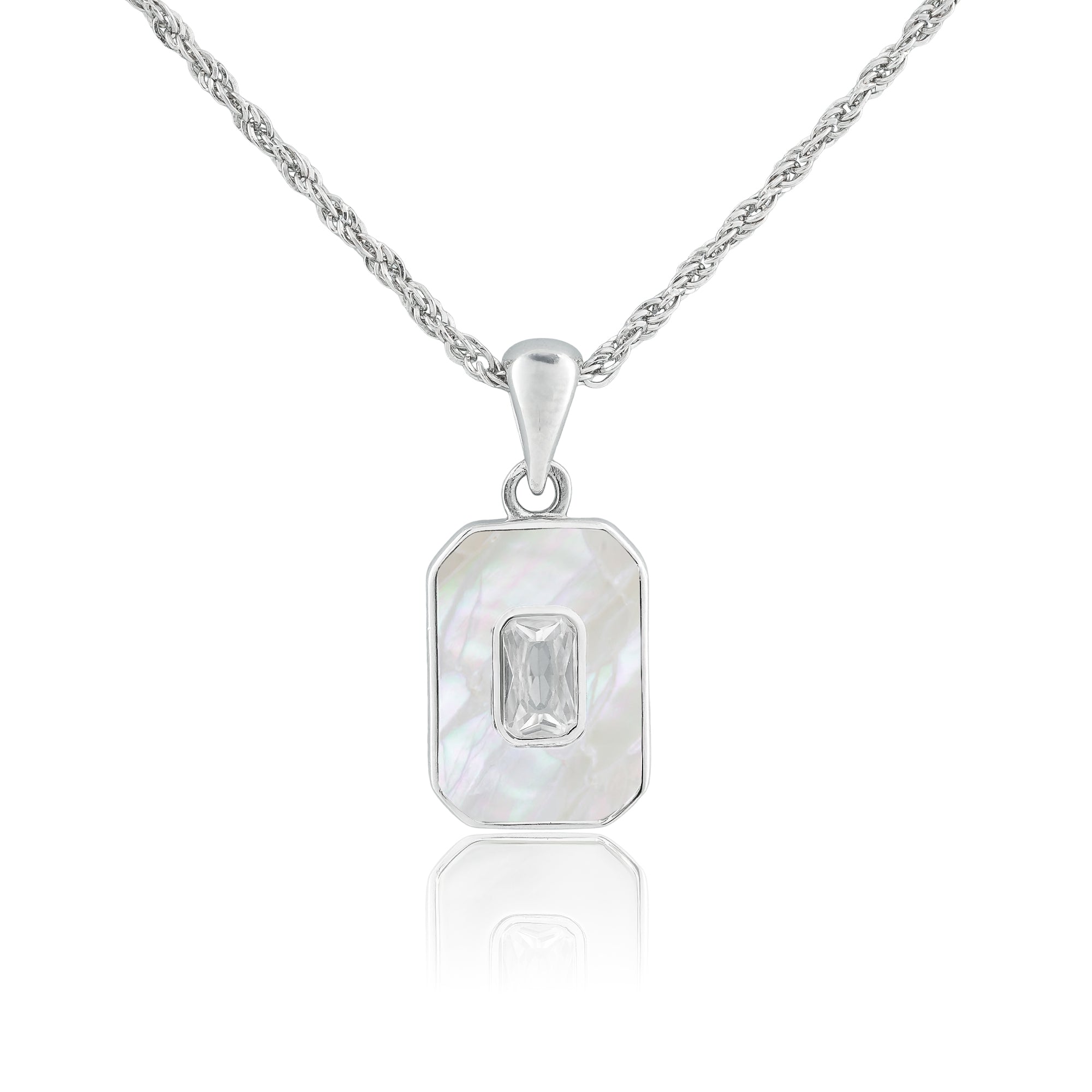 Close-up of the Solitaire Tag Necklace featuring a rectangular tag pendant with a bezel-set baguette-cut stone on a fine sterling silver chain.