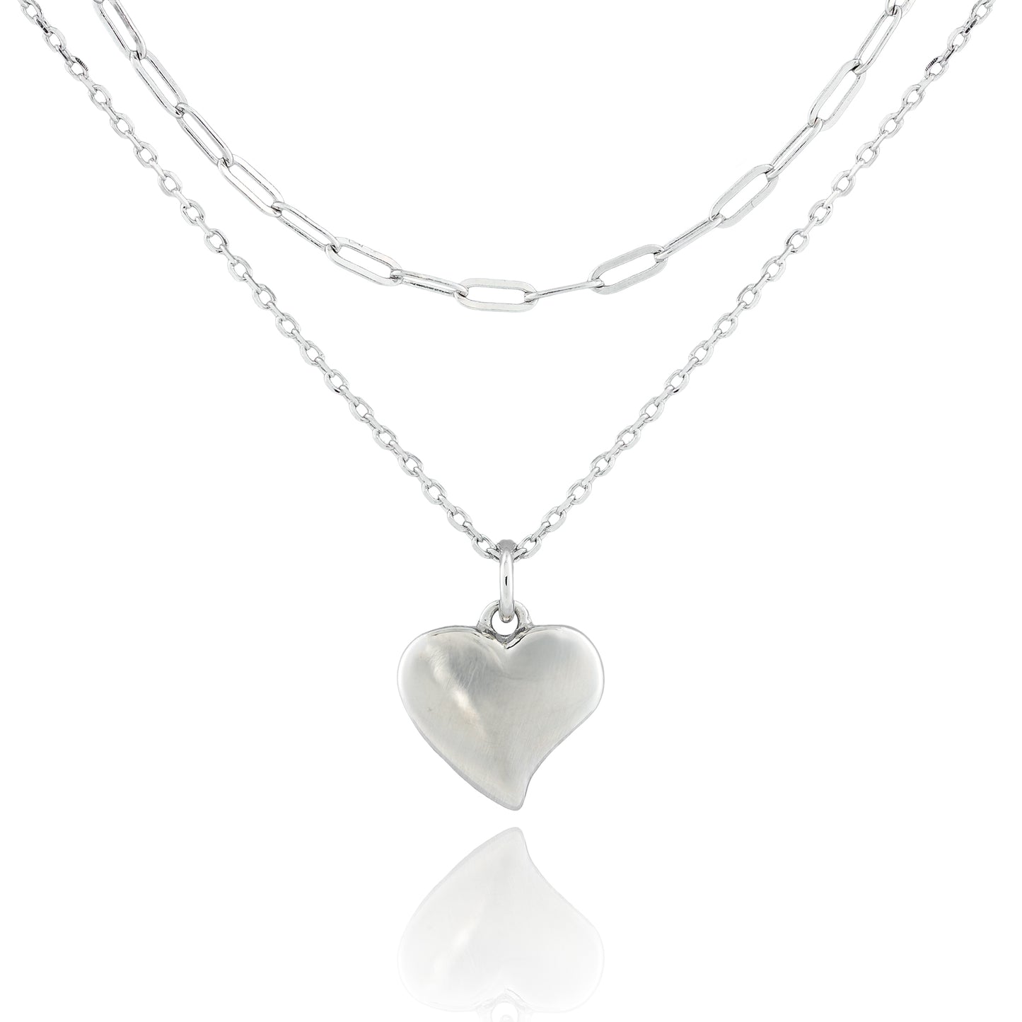 Close-up of the Sweetheart’s Love Necklace with a puffed heart pendant on dual sterling silver chains, featuring classic and paperclip link styles.