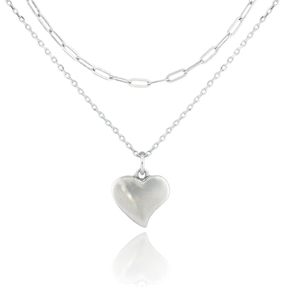 Close-up of the Sweetheart’s Love Necklace with a puffed heart pendant on dual sterling silver chains, featuring classic and paperclip link styles.