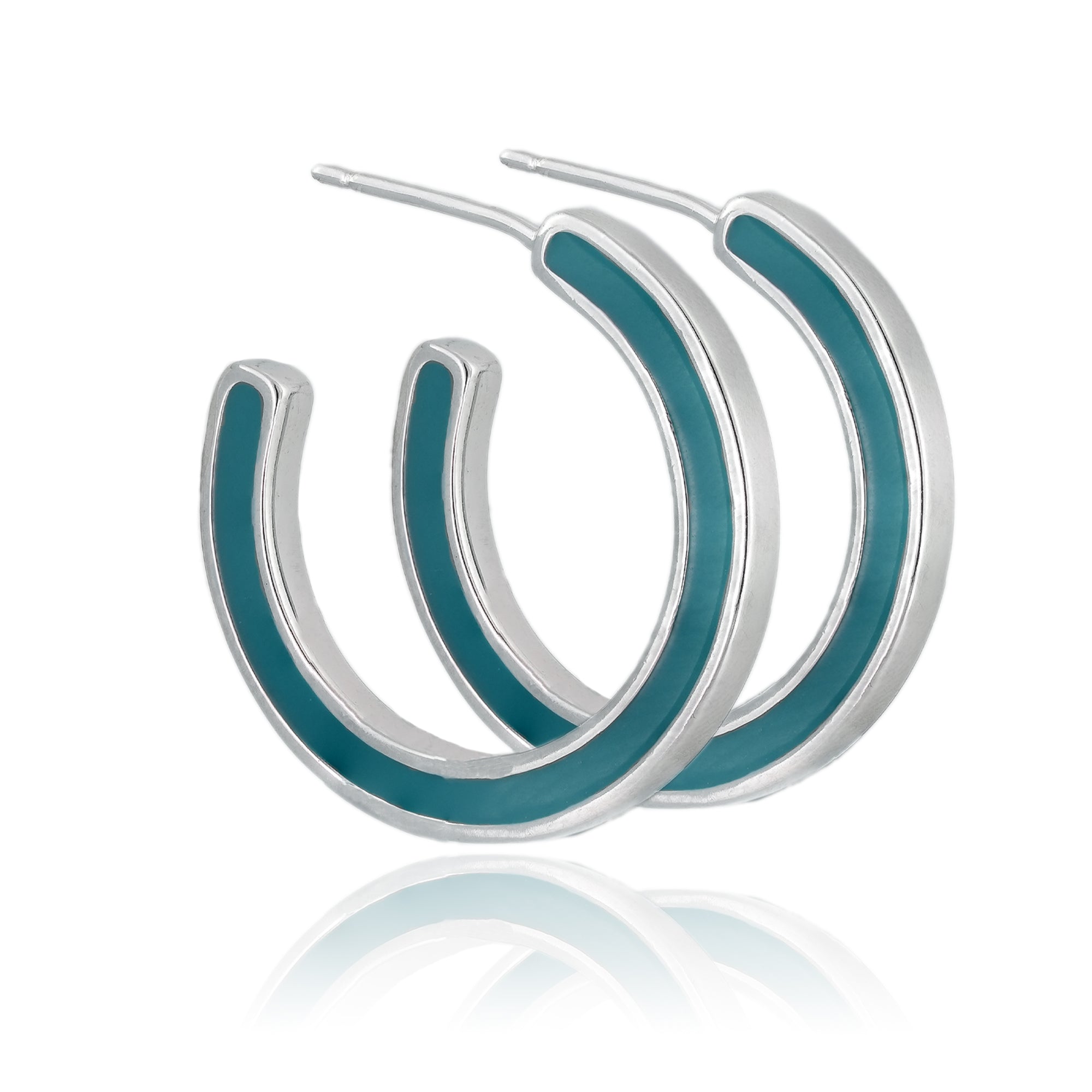 Medium-sized sterling silver hoop earrings with teal enamel inlay, displayed on a clean background.

