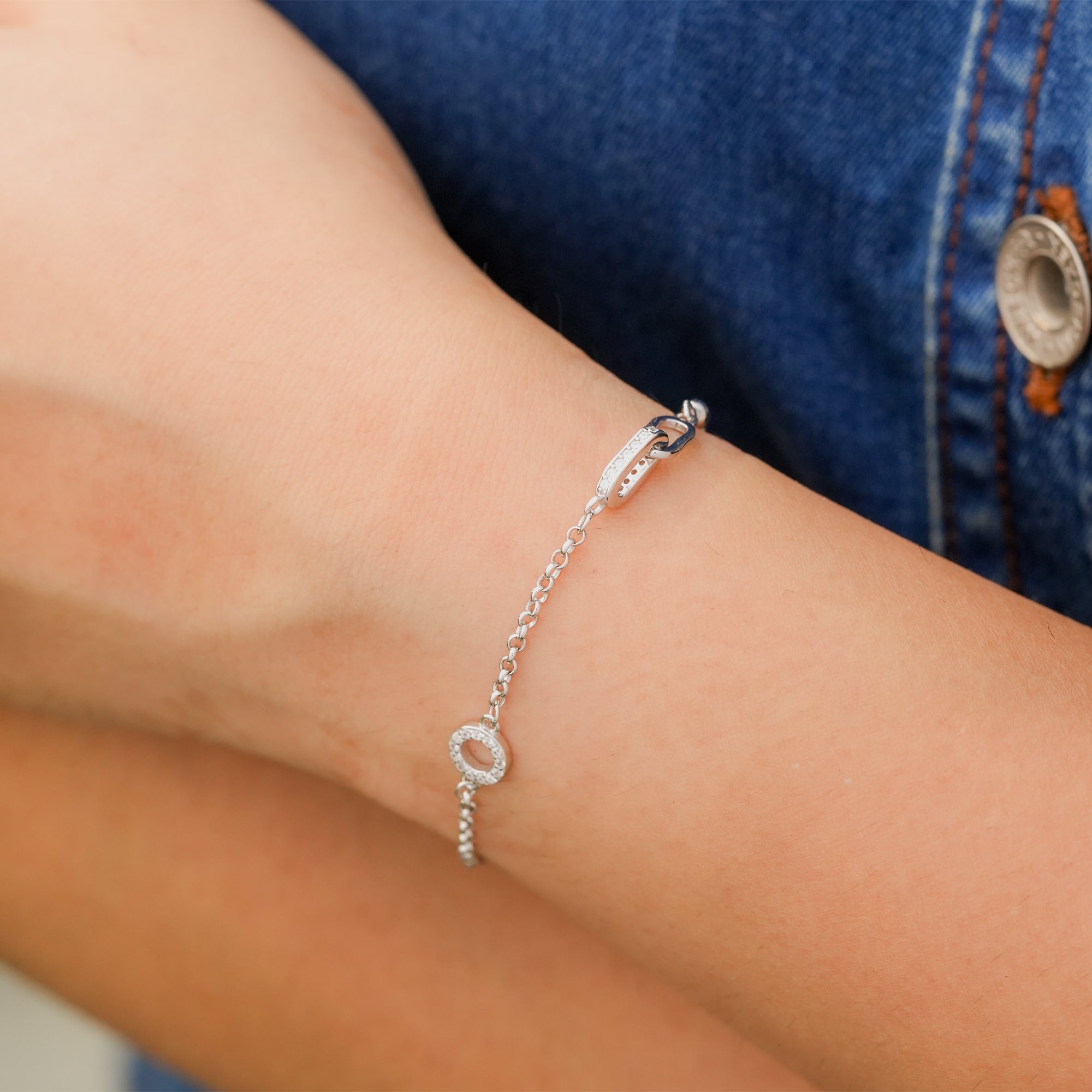 Model elegantly styling the Halo Loop Harmony Bracelet with minimal attire for a refined, everyday look.