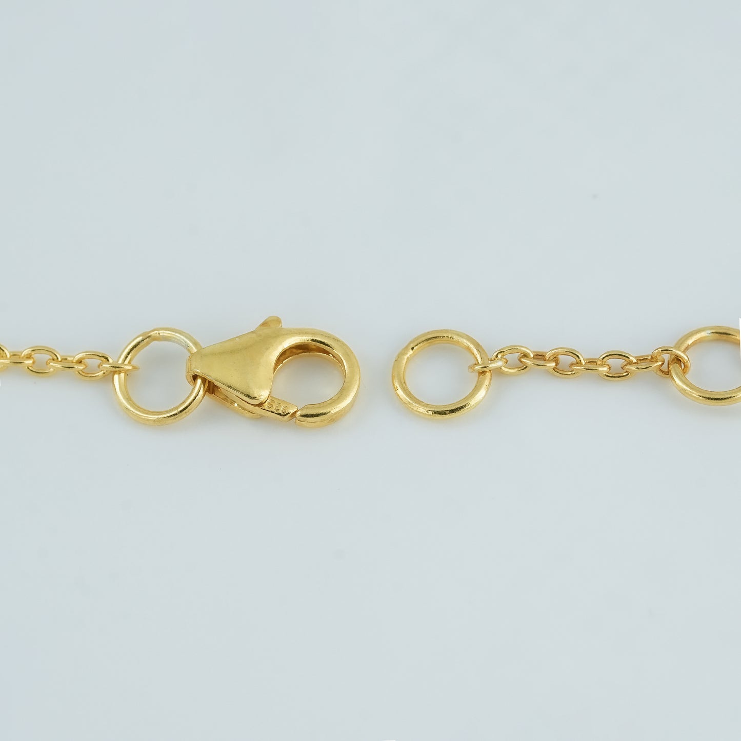 "Adjustable gold-plated clasp on 925 sterling silver Ruby Rose Garden Bracelet with 6-inch fit and 0.5-inch extension."