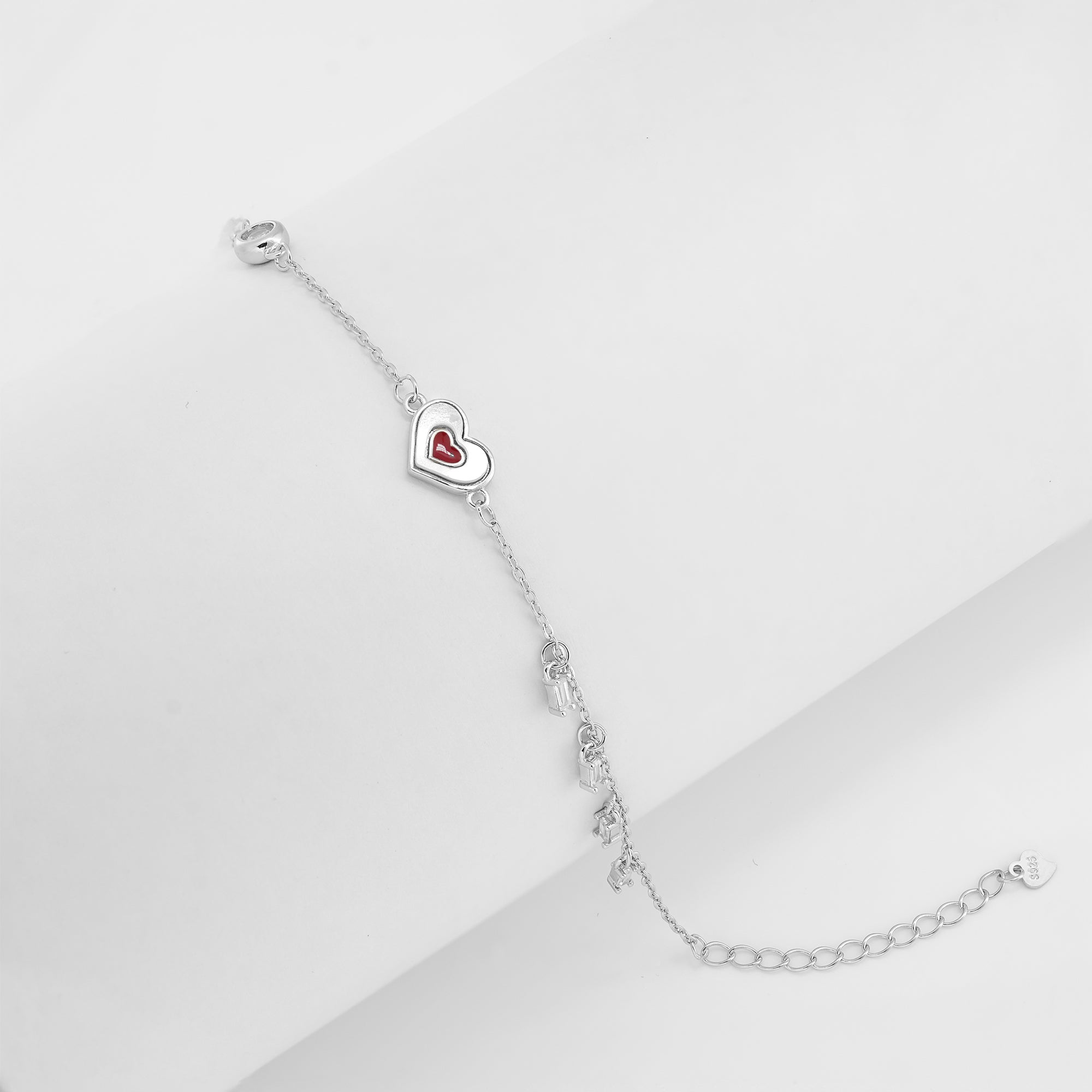 925 sterling silver bracelet with red enamel heart charm and mini dangling elements – IHA Fine Jewellery
